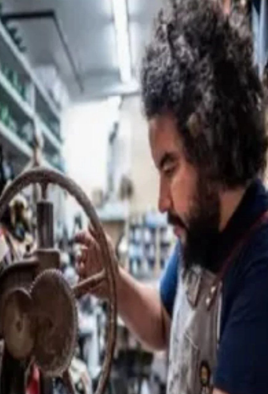Khalid Naitzehou working in his shop
